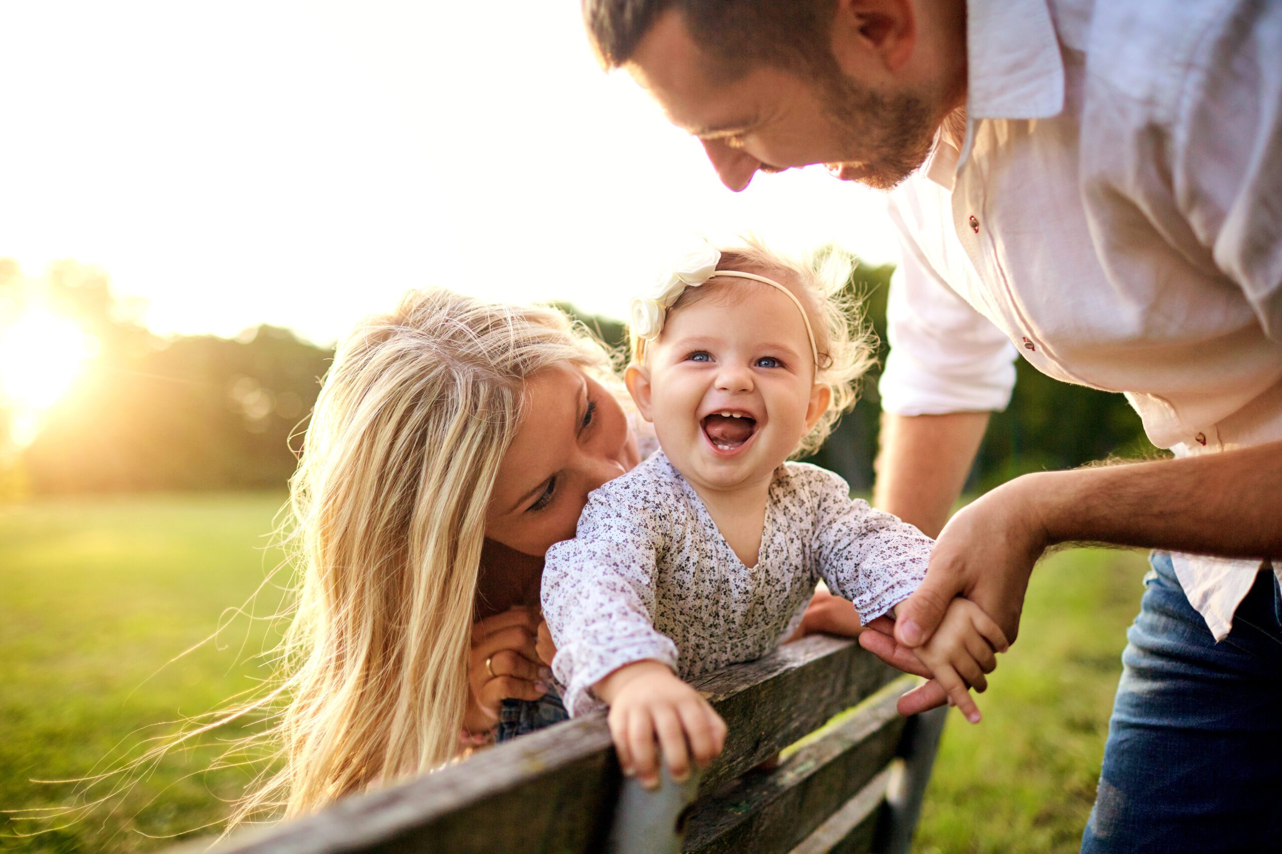 Happy family in a park in summer autumn.